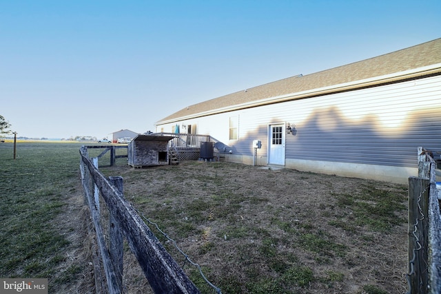 rear view of property with fence