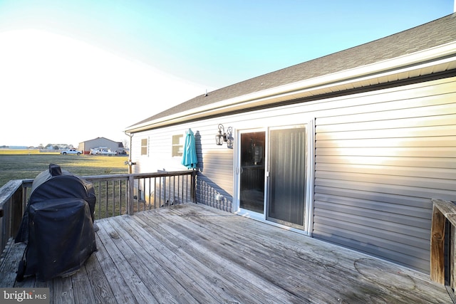 wooden deck featuring grilling area