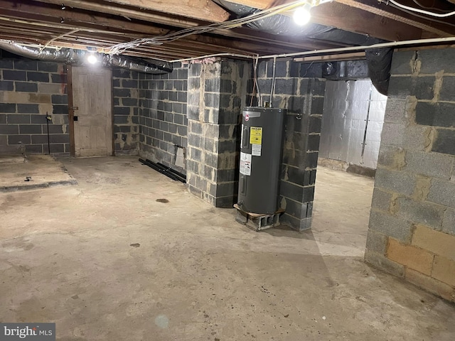 unfinished basement featuring electric water heater