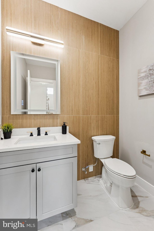 6935 Southridge Dr, Mclean, VA 22101 - bathroom with marble look tiles and vanity