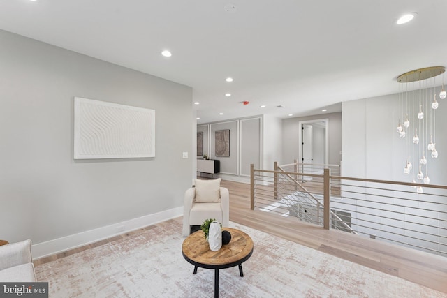 6935 Southridge Dr, Mclean, VA 22101 - sitting room featuring wood finished floors, recessed lighting, baseboards, and an upstairs landing