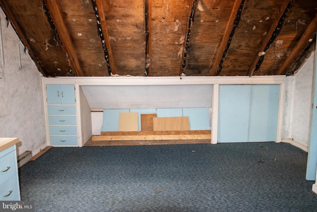 bonus room with lofted ceiling, baseboard heating, and carpet flooring