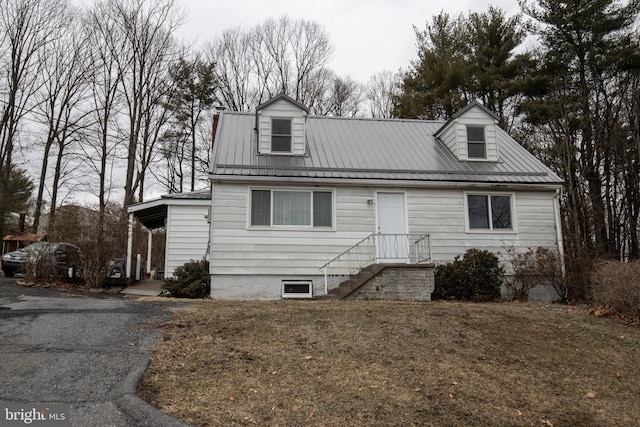 new england style home with metal roof