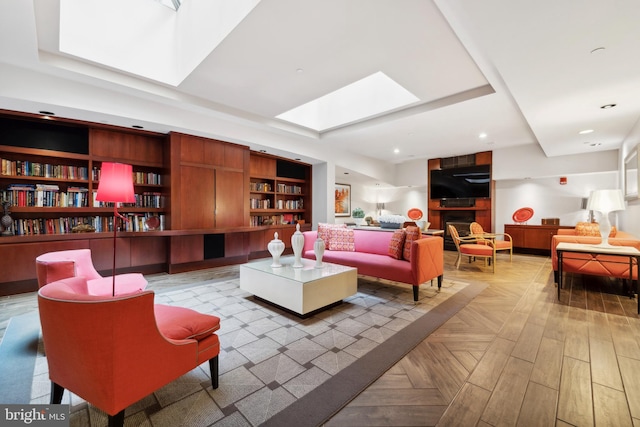 living area with recessed lighting, a skylight, and built in features