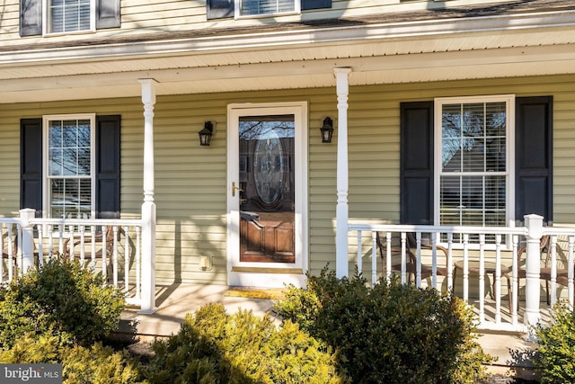 doorway to property with a porch