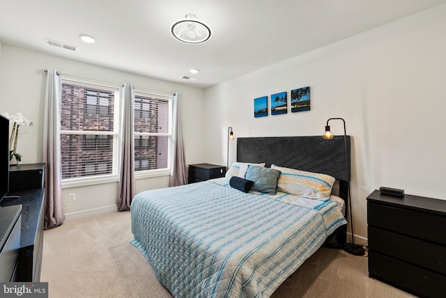 carpeted bedroom with baseboards, visible vents, and recessed lighting