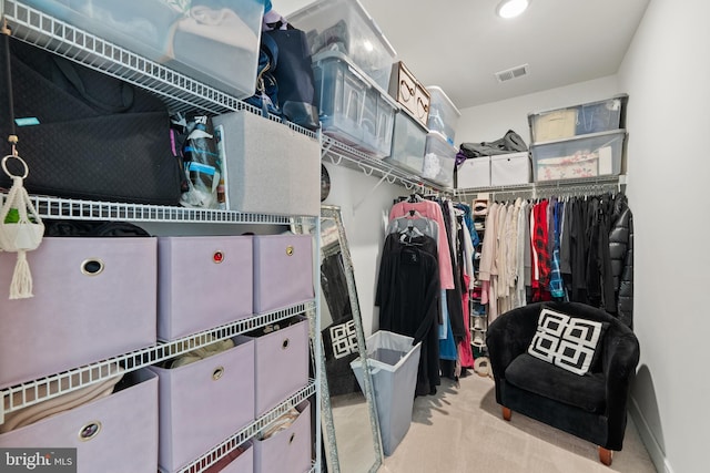 walk in closet featuring carpet and visible vents