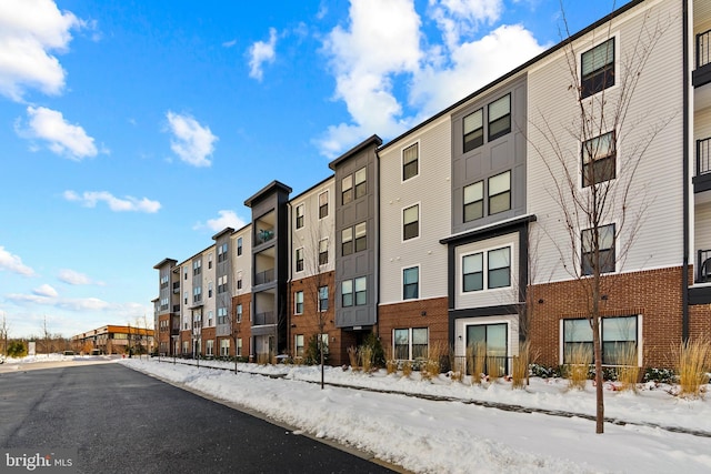 snow covered building with a residential view