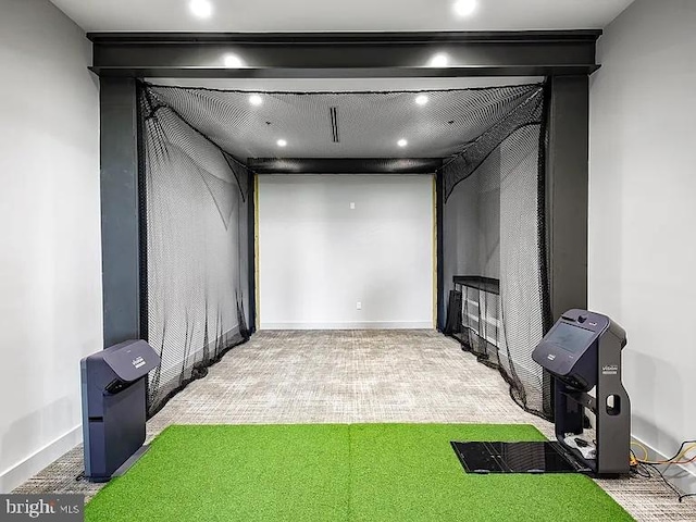 carpeted cinema room with baseboards