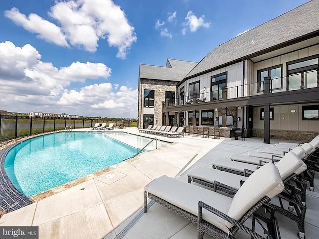 pool featuring a patio