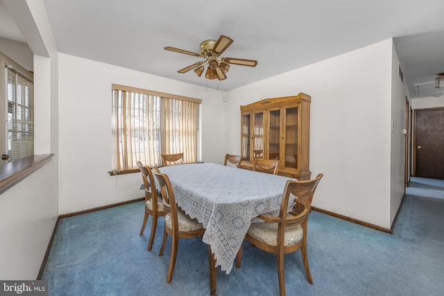 carpeted dining area featuring ceiling fan, visible vents, baseboards, and attic access