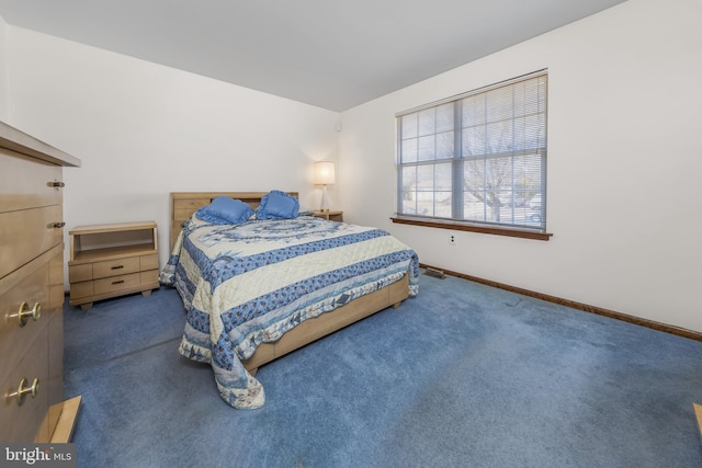 bedroom with carpet and baseboards