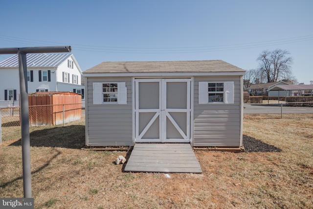 view of shed with fence