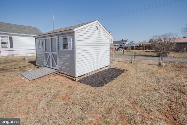 view of shed with a gate and fence