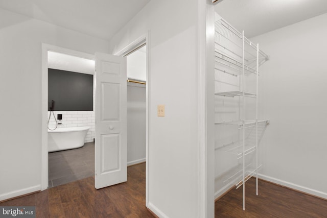 spacious closet with wood finished floors