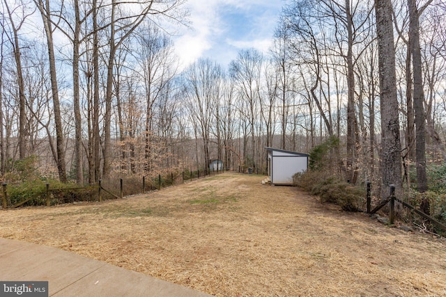 view of yard with a shed and an outbuilding