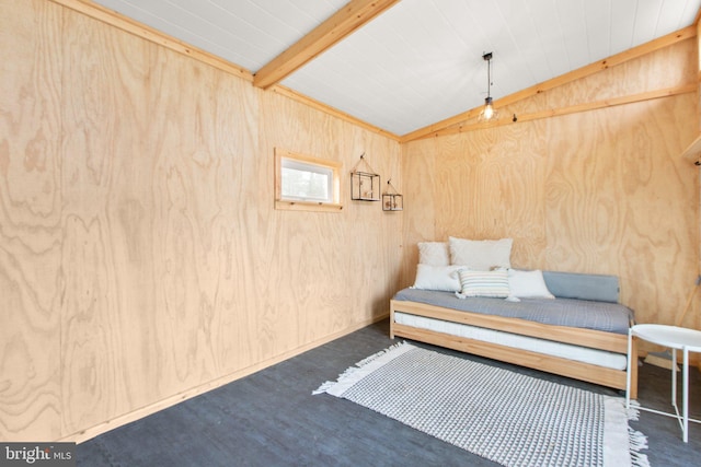 unfurnished room featuring vaulted ceiling with beams and wood walls