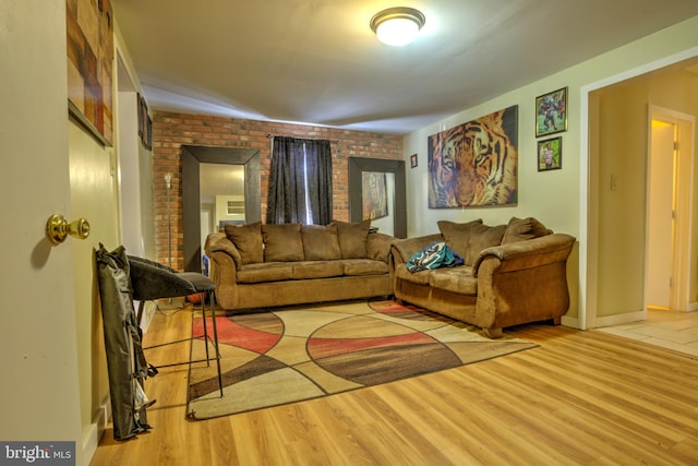 living room featuring wood finished floors and baseboards