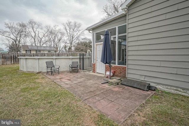 view of patio / terrace with a fenced in pool and fence