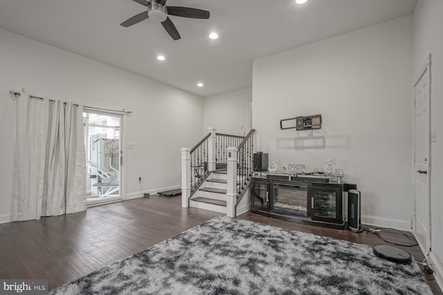 foyer entrance featuring ceiling fan, recessed lighting, wood finished floors, baseboards, and stairs