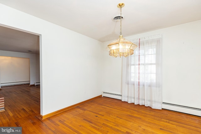 unfurnished room featuring visible vents, baseboards, a baseboard radiator, wood-type flooring, and a chandelier