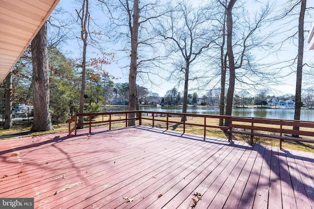 wooden deck with a water view