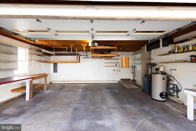 garage with a garage door opener and water heater