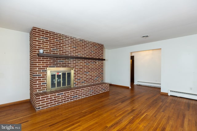 unfurnished living room featuring a baseboard radiator, a fireplace, baseboards, and hardwood / wood-style flooring