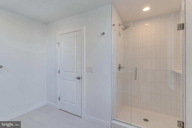 bathroom featuring baseboards, a stall shower, recessed lighting, and tile patterned floors