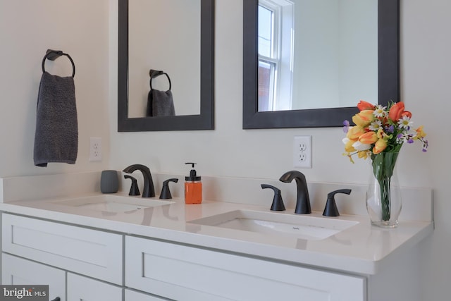 full bath with double vanity and a sink