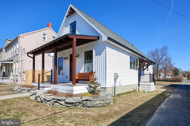 bungalow-style house with a porch and a shingled roof