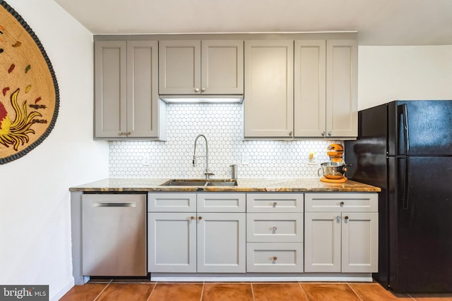 kitchen featuring a sink, gray cabinetry, dishwasher, and freestanding refrigerator