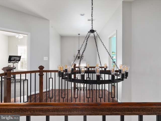 room details with visible vents, baseboards, and wood finished floors