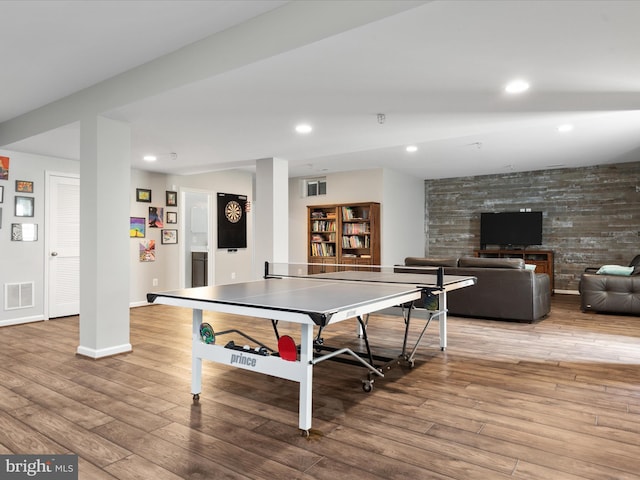 rec room with recessed lighting, visible vents, baseboards, and wood finished floors