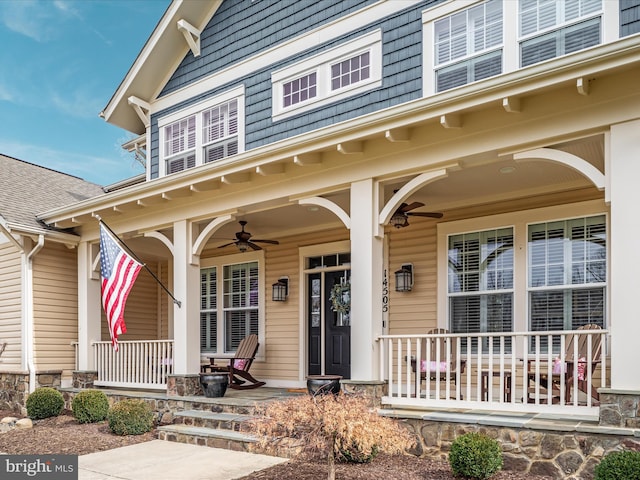 doorway to property featuring ceiling fan and a porch