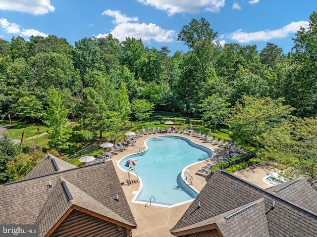 pool featuring a patio and fence