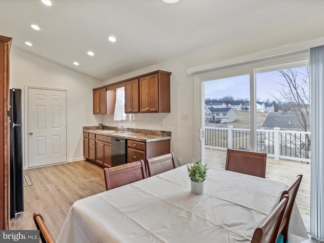 dining area featuring lofted ceiling, light wood-style flooring, baseboards, and recessed lighting