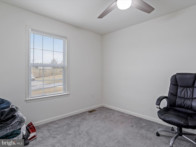 interior space featuring carpet, visible vents, ceiling fan, and baseboards