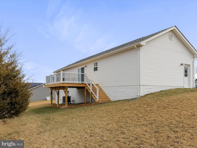 rear view of house featuring stairs, central AC, a yard, and a deck