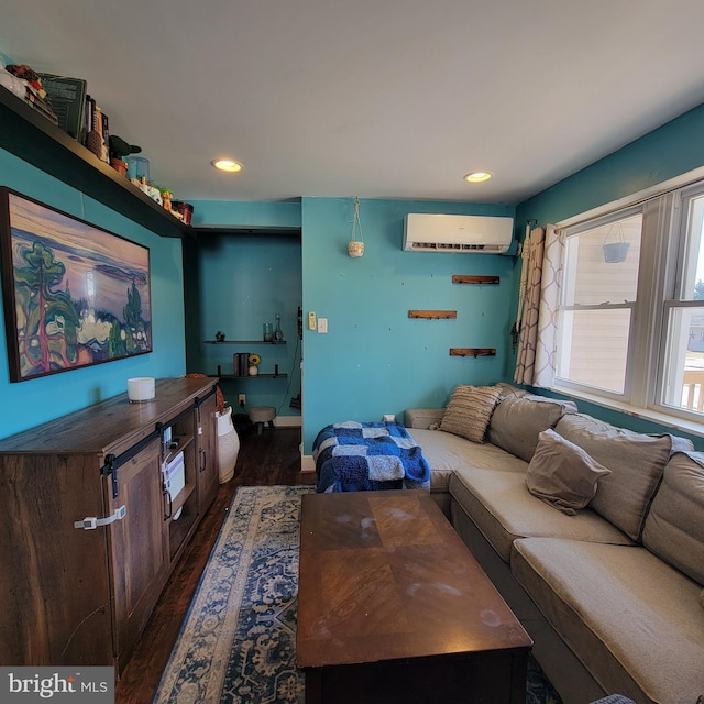 living area featuring a wall unit AC, dark wood-style floors, and recessed lighting