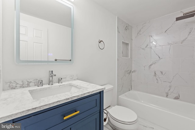 bathroom featuring toilet, marble finish floor, bathtub / shower combination, and vanity