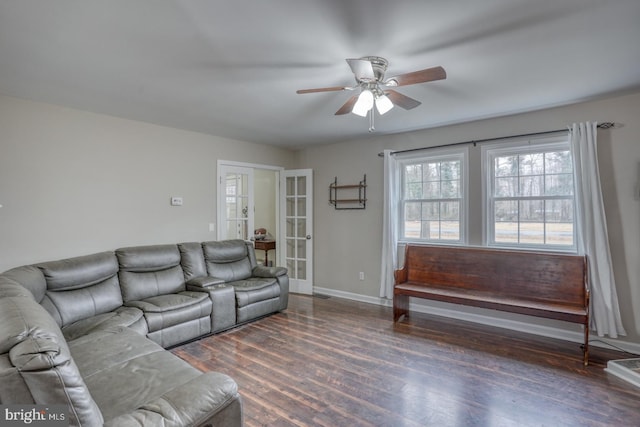 living area with ceiling fan, baseboards, wood finished floors, and french doors