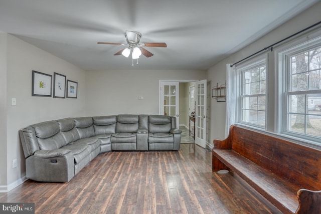 living room featuring ceiling fan, french doors, wood finished floors, and baseboards