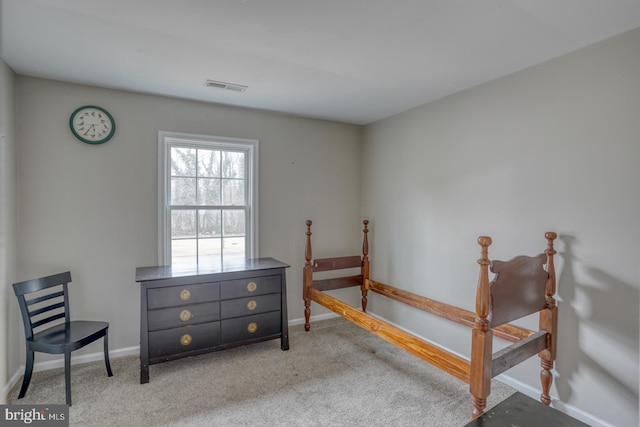 bedroom with carpet floors, visible vents, and baseboards