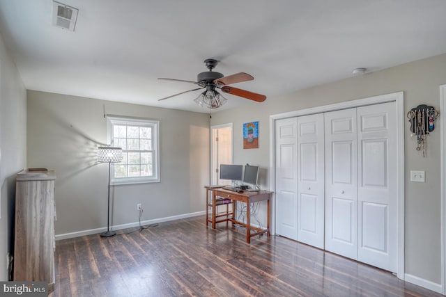 home office with ceiling fan, wood finished floors, visible vents, and baseboards