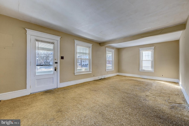 interior space with carpet floors and baseboards