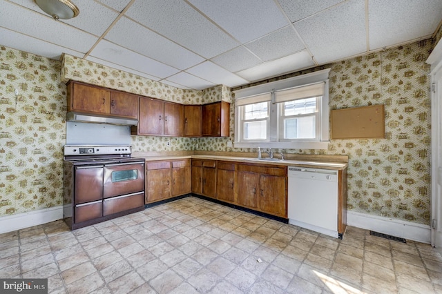 kitchen with wallpapered walls, white dishwasher, under cabinet range hood, and range with electric stovetop