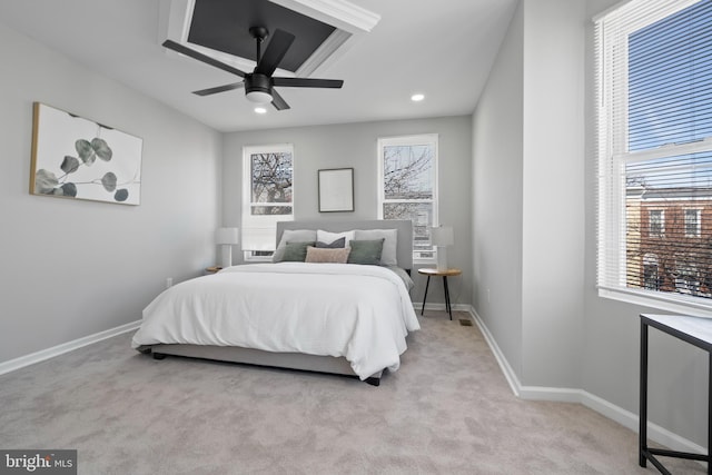 carpeted bedroom with multiple windows, baseboards, a ceiling fan, and recessed lighting