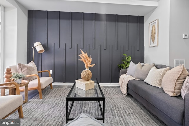 living room with wood finished floors and visible vents