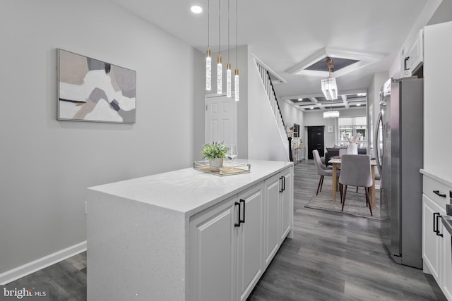 kitchen with white cabinetry, pendant lighting, dark wood-style flooring, and freestanding refrigerator